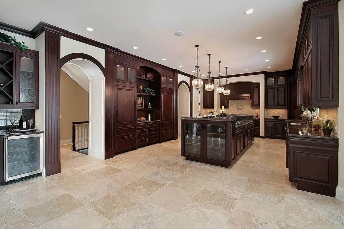 Kitchen with dark wood cabinets and island