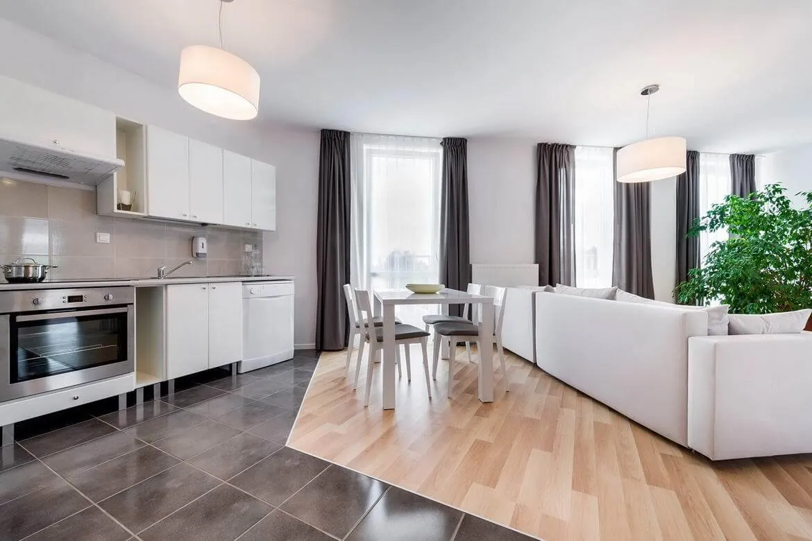 Open-plan kitchen and dining area with wooden flooring